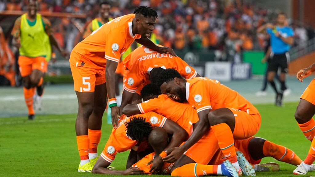 IVORY COAST CELEBRATING THEIR WIN.